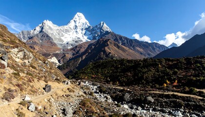 Mountain peak with a trail through autumnal landscape