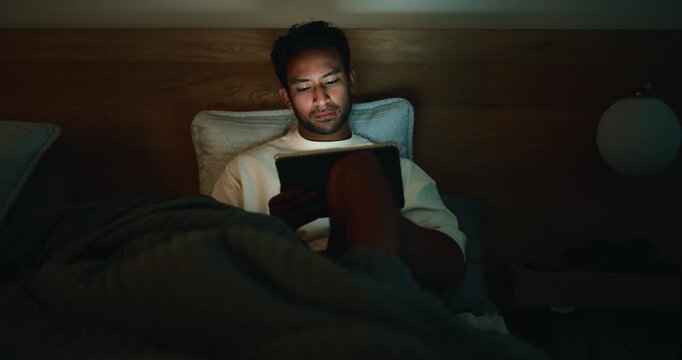 Night, bedroom and man with tablet, reading and search for daily news, social media update and network. Doom scrolling, tech and person with ebook, home and blue light exposure with app and internet