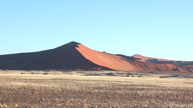 a zoom in shot of a sand dune at sunrise at sossusvlei in namibia, africa