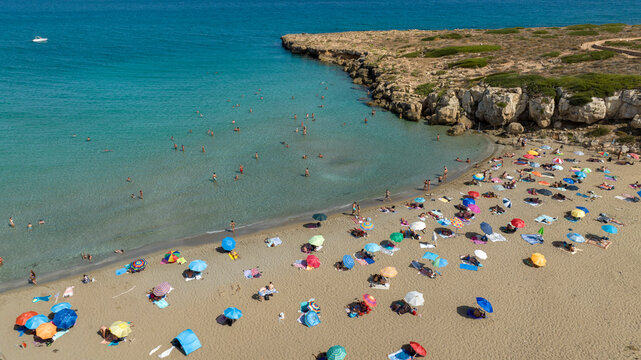 Aerial closeup of Cala Mosche (or Calamosche) beach, a beautiful sandy beach within the Vendicari Nature Reserve, near Noto, Sicily, Italy. It's famous for its crystal clear and blue waters. Sunny day