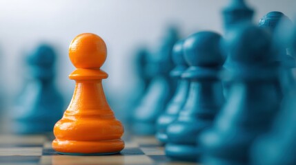 Orange pawn standing out from a line of blue pawns on a chessboard. Concept of individuality, leadership, uniqueness, and strength in business.
