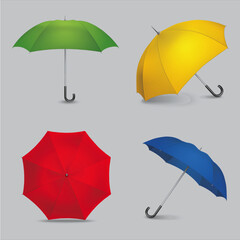 Collection of four colorful vector umbrellas including green yellow red and blue designs on gray