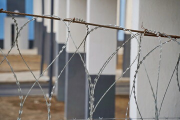 Barbed wire. Metal fencing in prisons, at borders and places of special regime.
