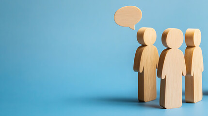 Wooden figurines symbolize a team in discussion.  A collaborative environment fosters creative solutions.  Ideas are born through conversation and shared experiences.