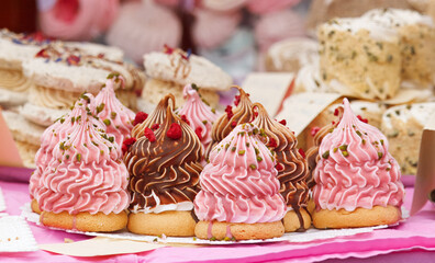 Gorgeous Czech &ldquo;Indi&aacute;n&rdquo; desserts with glossy chocolate and fruity pink swirls tempt visitors at the lively Naplavka market, inviting anyone passing by to indulge in their sweet, airy richness.