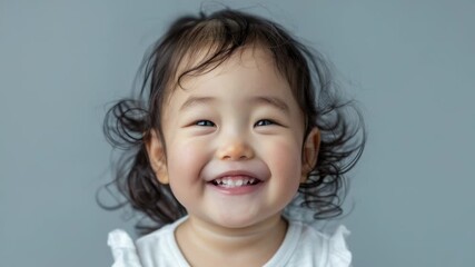 Video A young girl with a bright smile and joyful expression
