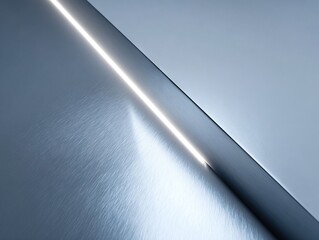 Minimalist metallic surface divided by a sharp glowing diagonal light beam, creating a sleek modern composition that emphasizes contrast, geometry, and refined elegance