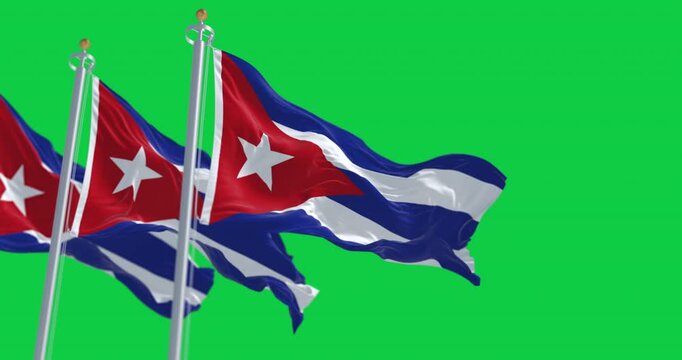Three Cuban flags waving isolated on green background