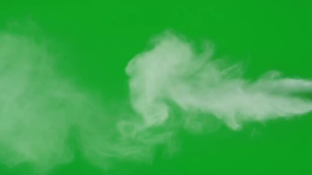 Dense white smoke or steam puffing out and expanding dramatically against a vivid green screen background ideal for realistic visual effects and compositing projects