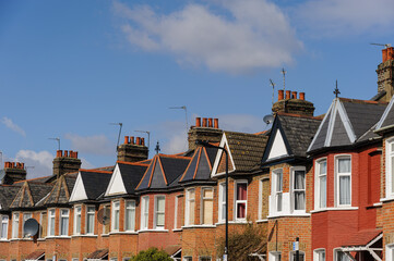 Row of terraced houses in residential Street in London, UK