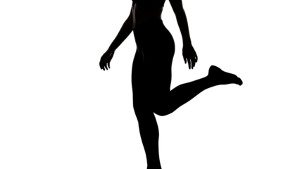 Female silhouette with one leg raised against black