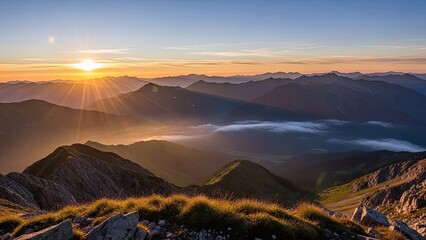 🌄 Majestic mountain landscape at sunrise and sunset with orange clouds and morning mist in the valley