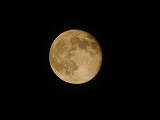  Full moon photo, close up. Visible craters and shadows, beautiful bright moonlight, moon phase with black universe background.