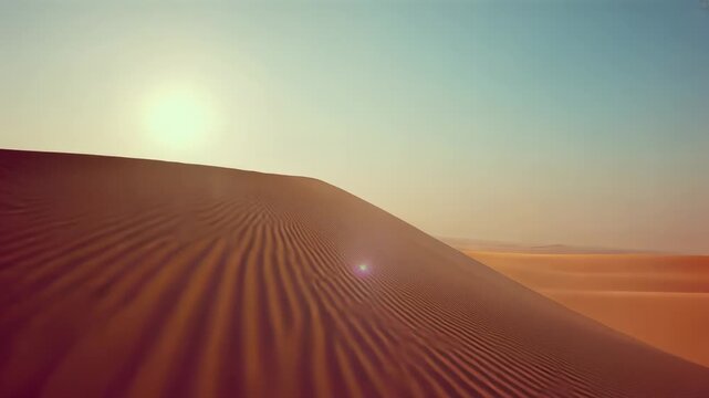 Starting drone camera gliding over sand dune crest at desert ridge, with sun flare showing ripples