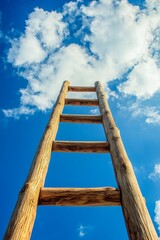 Wooden ladder leaning against bright blue sky with white clouds, symbolizing upward climb, growth, and success against clear backdrop.