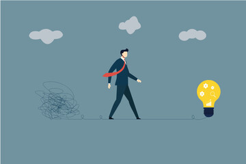 Businessman Walking from Chaos to Lightbulb: Corporate Problem Solving and Simplifying Complexity Concept
