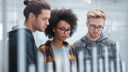 Group of Diverse Young Adults Engaging in Brainstorming and Collaboration in Modern Office Environment 4k video footage - Powered by Adobe
