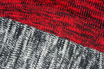 Fondo o textura de jerseys de lana con colores blanco, negro y rojo