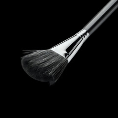 Professional makeup blending brush with dark synthetic bristles against a stark
