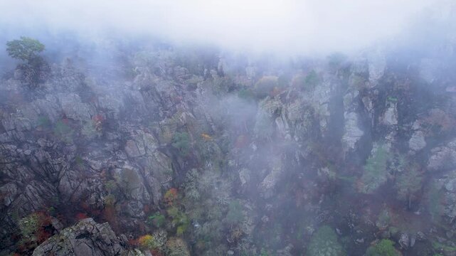 Aerial view of foggy rocky mountains The Concept of Mystery
