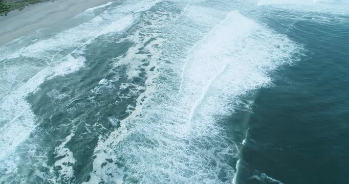Wide aerial view of ocean waves and beach The Concept of Vastness