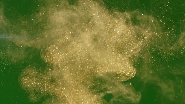 Abstract gold dust swirling vortex with abstract gold dust patterns creating effect green screen gold dust shimmer style featuring