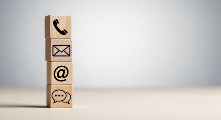 Contact Information Icons on Wooden Blocks Stacked Vertically Communication Methods on Desk Surface