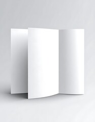 A white, folded, three-paneled brochure stands against a neutral background with soft shadows indicating direction