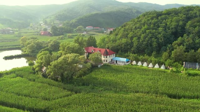 Tranquil Villa with Red Roof in Countryside Farmland Surrounded by Forest