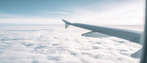 Obraz premium View from airplane window above the clouds 