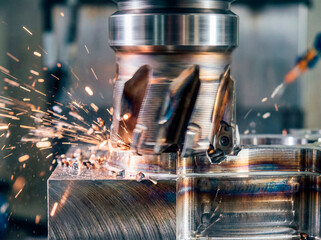 Close-up of a CNC milling cutter machining metal, creating bright sparks and scattering chips. High-detail industrial process showing cutting edges, heat marks, and dynamic motion