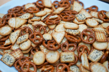 pretzels and biscuits placed on a plate. detail.