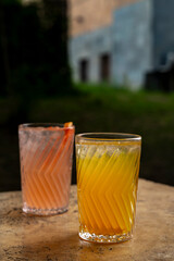 Colorful Cocktails in Glasses with Straws on the Table