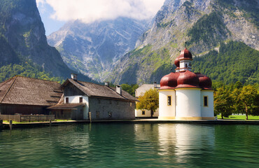 Konigsee lake with st Bartholomew church surrounded by mountains, Berchtesgaden National Park, Bavaria, Germany