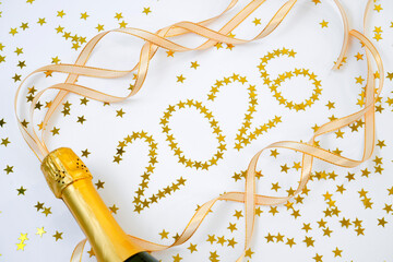 2026 scene captures a moment of celebration and joy. Bottle of sparkling wine is poised to be opened, surrounded small golden stars that create a festive vibe.