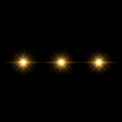 Three Golden Lens Flares on Black