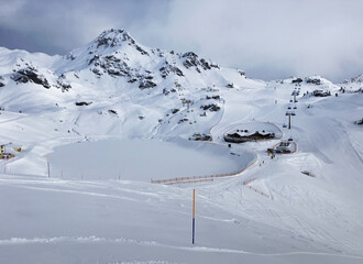 Beautiful alpine panoramic view snow capped mountains, European beautiful winter mountains in Alps, Slope for cross country skiers in landscape