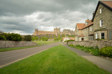 Naklejka premium Bamburgh castle and village, Northumberland, England, UK (May 2017)