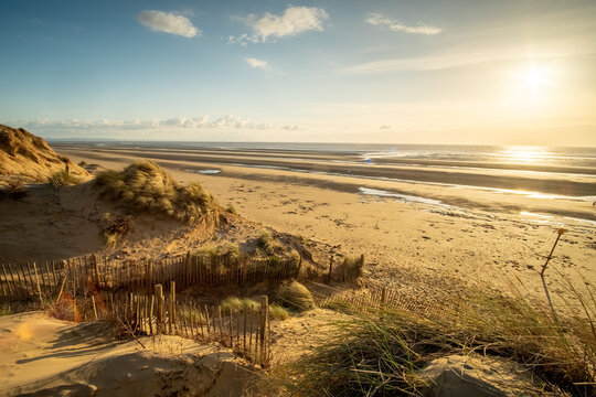 Large beautiful empty sandy beach, dunes, sea and sun, Formby coast, England, UK