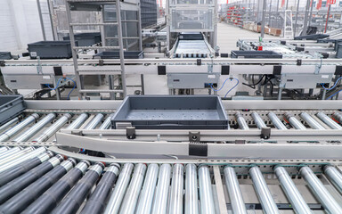 packing line in a logistics warehouse. conveyor belt in a modern production line