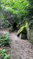 Fototapeta premium Tranquil Moss-Covered Stone Bench in a Secluded Garden Nook