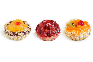 Cake basket with cream and fruits isolated on white background