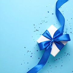 White gift box with blue ribbon, confetti