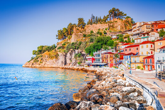 Parga, Greece. Picturesque coastal town in Epirus region, sunrise golden hour and colorful houses.