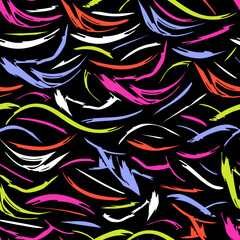 Seamless abstract pattern with vivid neon brush strokes on black background. Ideal for fashion textiles, sportswear, leggings, swimwear, streetwear and modern graphic design projects.