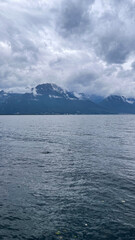 Cloudy Day Over a Serene Mountain Lake with Distant Shores, Switherland