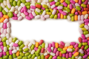 Sweet multicolored candies isolated on a white background.