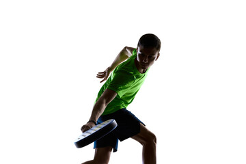 Padel athlete low forehand slice silhouette in athletic motion. Concept of sport education,...