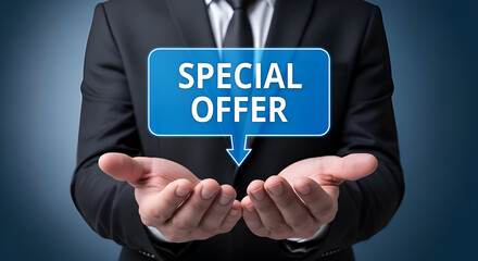 Businessman in dark suit presenting a glowing blue digital speech bubble with the words special offer floating above his open hands against a dark background