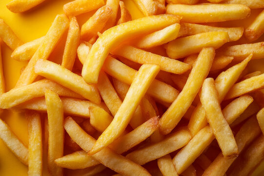 Crispy pommes frites spread across the frame as a food backdrop.